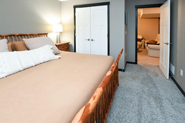 carpeted bedroom featuring a closet