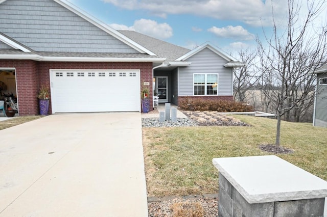 view of front of home featuring a garage and a front yard