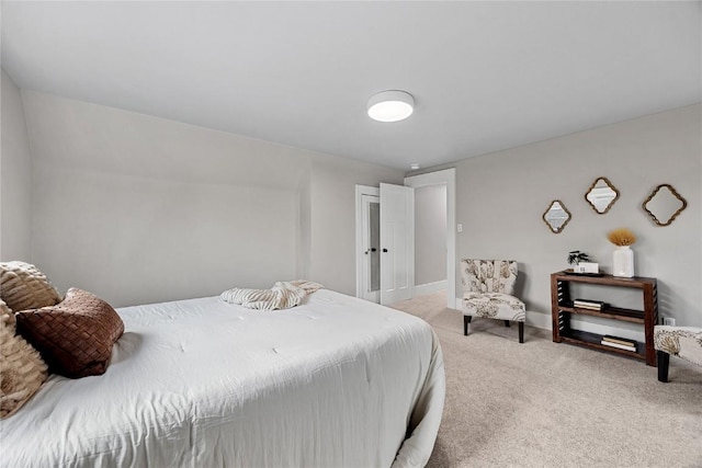 bedroom featuring light carpet