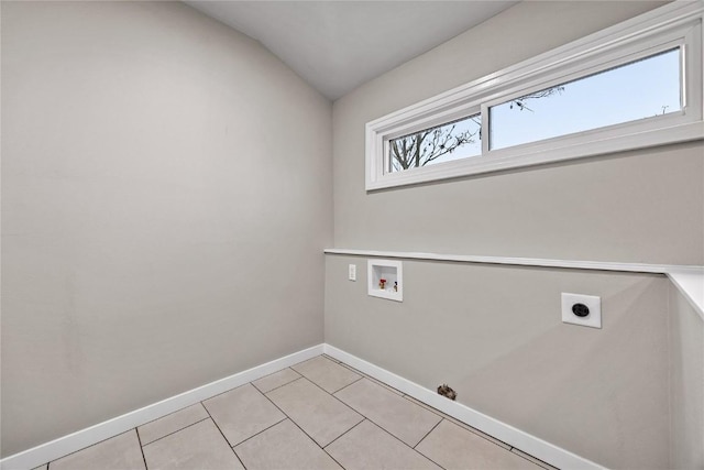 clothes washing area with hookup for a washing machine, hookup for an electric dryer, and light tile patterned floors