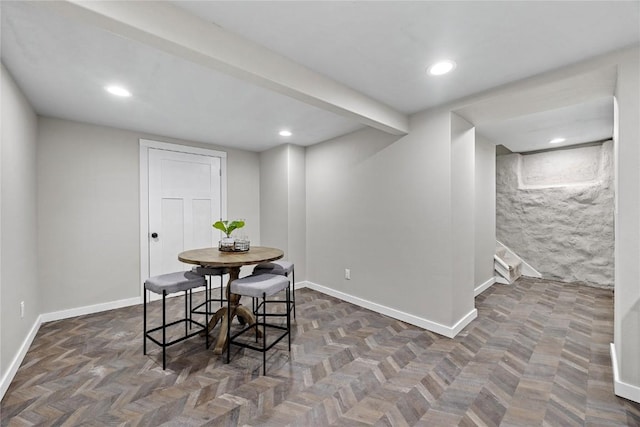 dining area featuring dark parquet floors