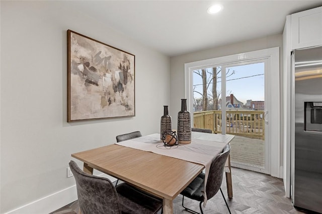 dining room featuring light parquet floors