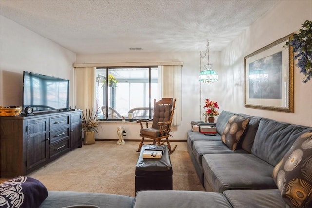 living room featuring light carpet and a textured ceiling