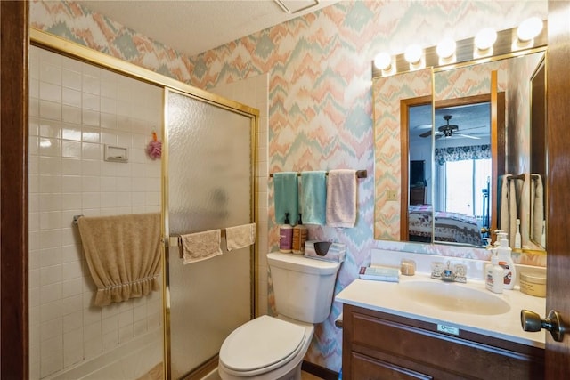 bathroom with toilet, an enclosed shower, a textured ceiling, vanity, and ceiling fan