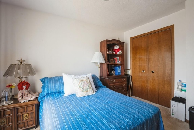 bedroom featuring a closet and carpet