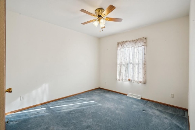 empty room featuring carpet floors and ceiling fan