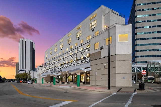 view of outdoor building at dusk