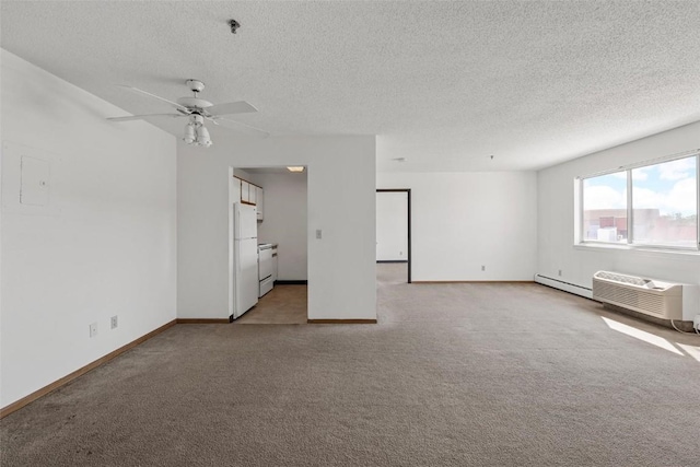 carpeted spare room featuring ceiling fan, a baseboard radiator, a wall mounted AC, and a textured ceiling