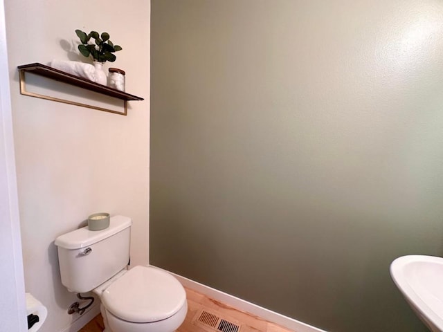 bathroom featuring sink and toilet