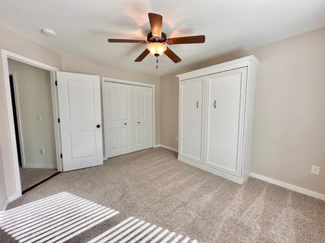 unfurnished bedroom with ceiling fan and light carpet