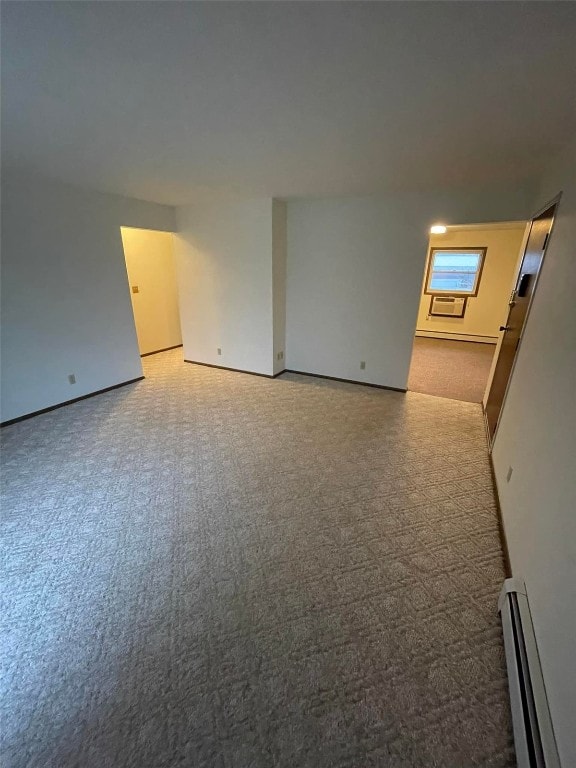 unfurnished room featuring a baseboard radiator