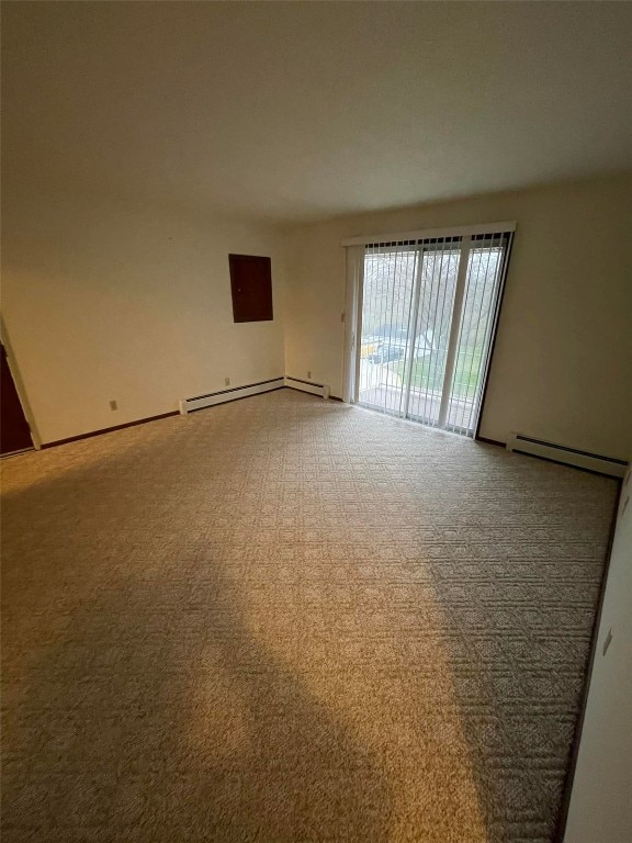 empty room featuring baseboard heating