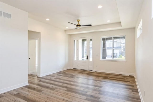 unfurnished room with hardwood / wood-style flooring and ceiling fan