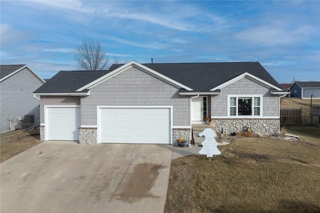 ranch-style home featuring a garage and a front yard