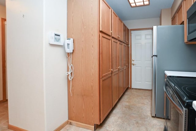 kitchen featuring stainless steel electric range oven