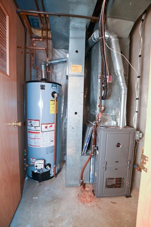 utilities featuring gas water heater and heating unit