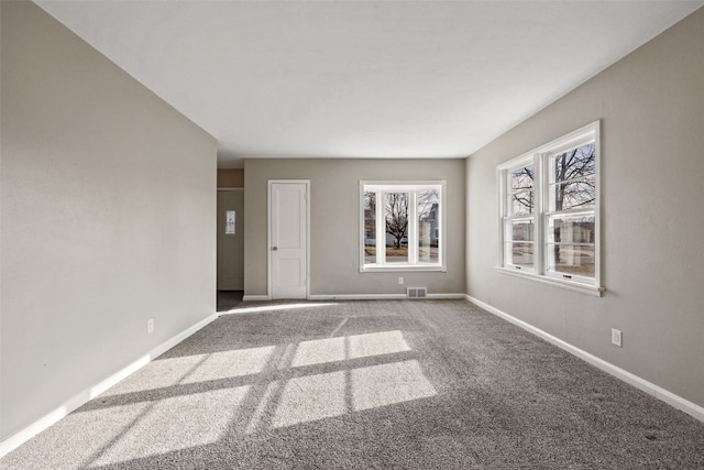 unfurnished room featuring carpet floors