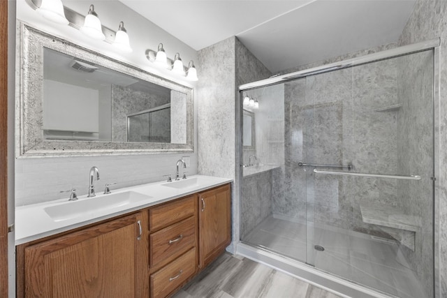 bathroom with vanity and an enclosed shower