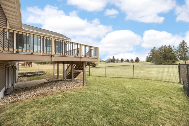 211 Wildcat Trl SW, Shellsburg, IA 52233 - view of yard with stairway, a wooden deck, and a fenced backyard