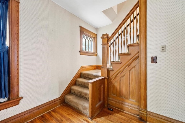 stairway featuring wood-type flooring