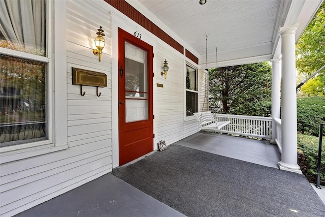 doorway to property with covered porch