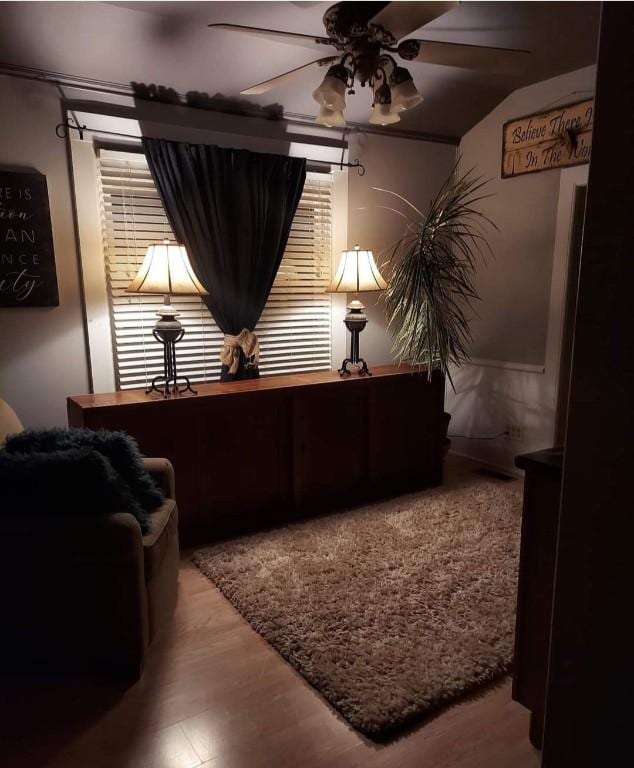 sitting room featuring ceiling fan