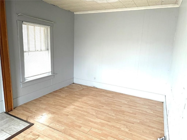 spare room featuring light hardwood / wood-style flooring