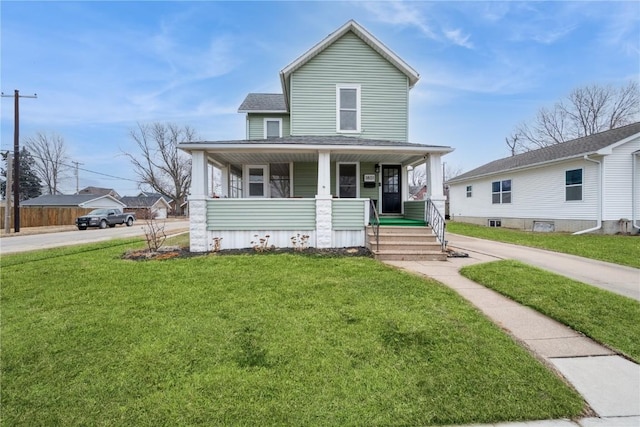 view of front of home with covered porch and a front lawn