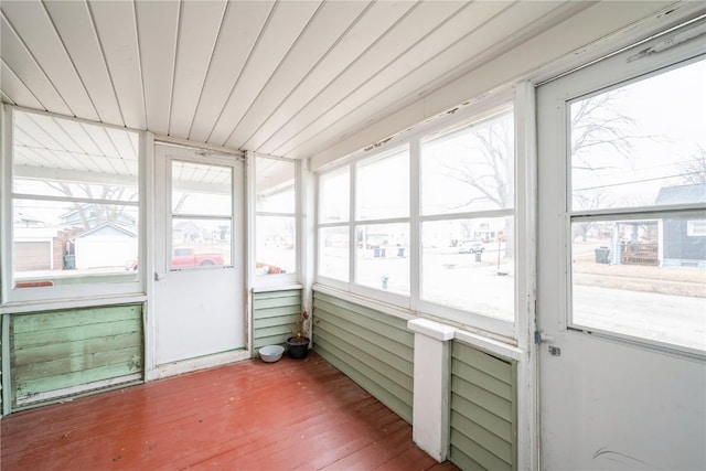 unfurnished sunroom with wood ceiling