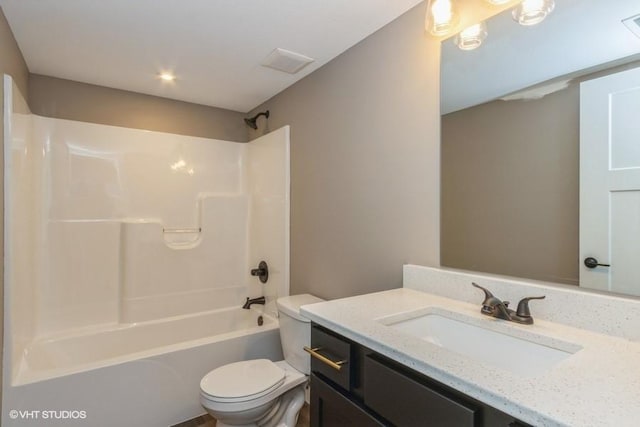 full bathroom featuring vanity, shower / washtub combination, and toilet