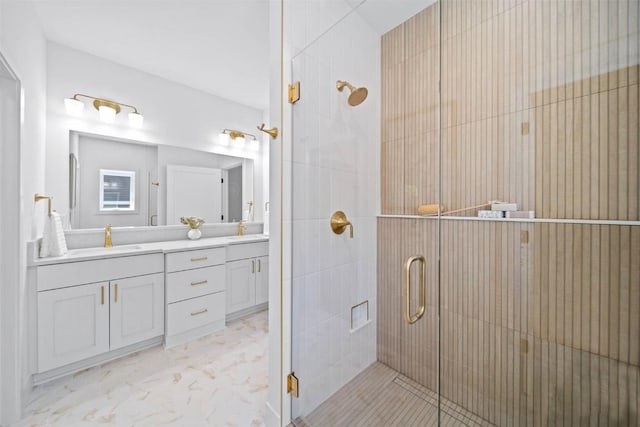 bathroom with vanity and an enclosed shower