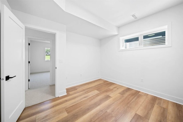 unfurnished room with light hardwood / wood-style flooring