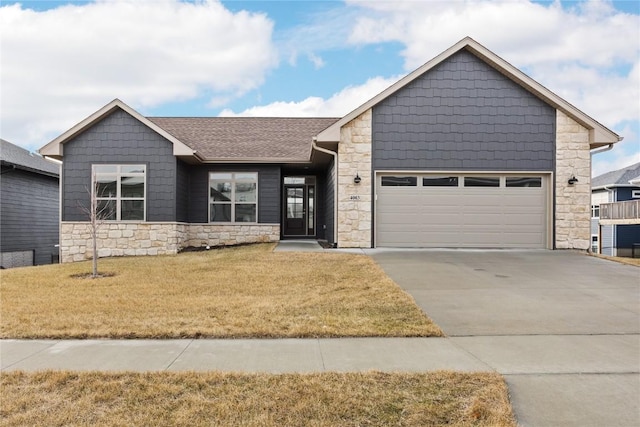 view of front of property with a garage and a front yard