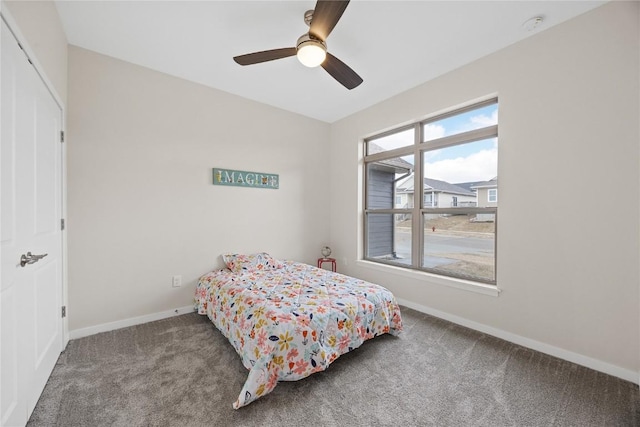 carpeted bedroom featuring ceiling fan