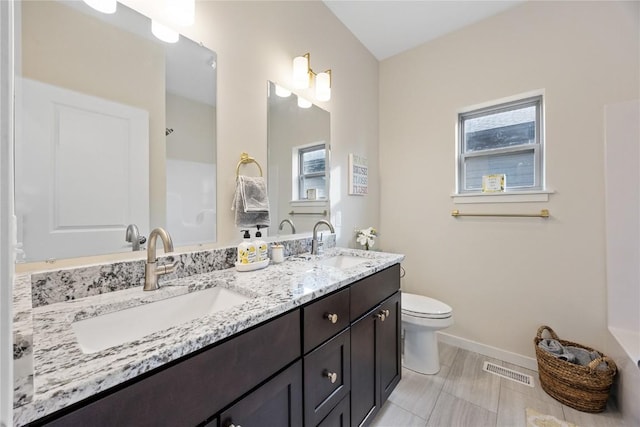 bathroom with vanity and toilet