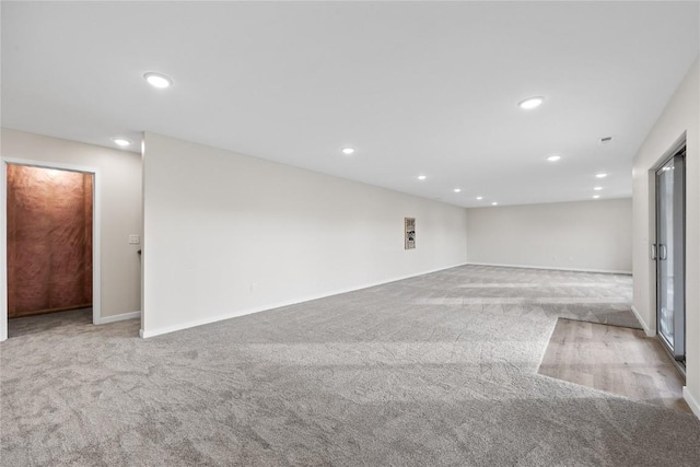 unfurnished room with light carpet