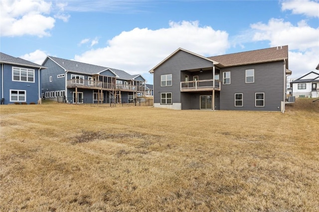 rear view of house with a yard