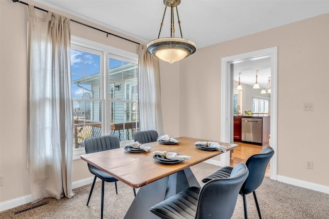 view of carpeted dining space