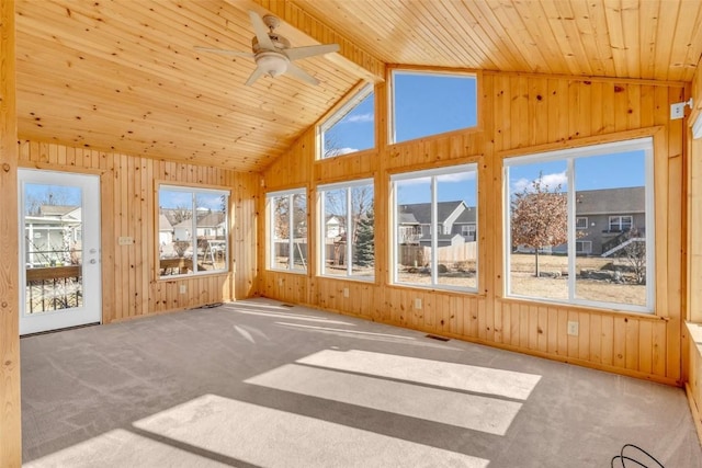 unfurnished sunroom with plenty of natural light, wooden ceiling, lofted ceiling, and ceiling fan