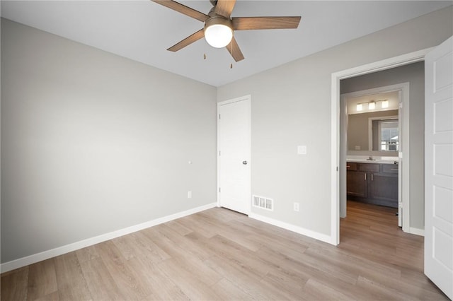 unfurnished bedroom featuring ceiling fan and light hardwood / wood-style floors