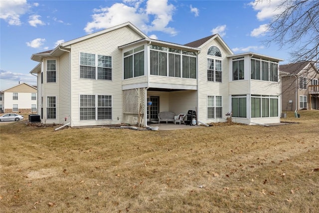 back of property featuring central AC, a patio, a sunroom, and a lawn