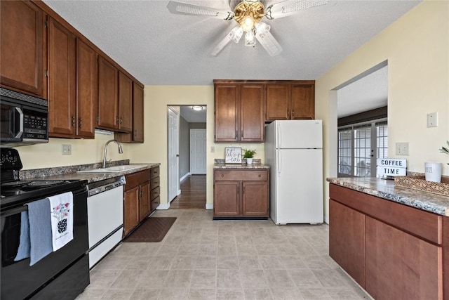 kitchen with sink, a textured ceiling, black appliances, and ceiling fan