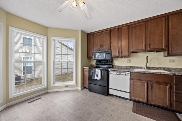 kitchen with dark brown cabinetry, sink, a textured ceiling, ceiling fan, and black appliances