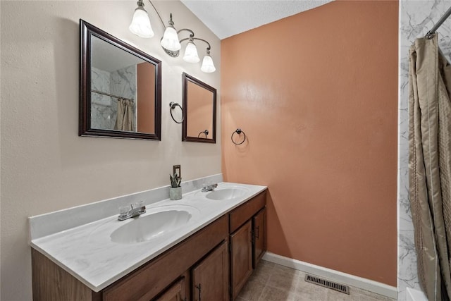 bathroom featuring vanity, tile patterned floors, and a shower with curtain