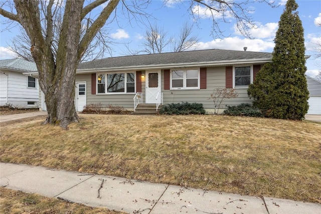 ranch-style home with a front lawn