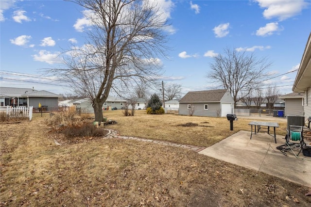 view of yard with a patio and an outdoor structure