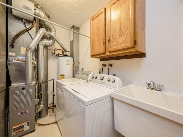 laundry room featuring water heater, separate washer and dryer, sink, cabinets, and a textured ceiling