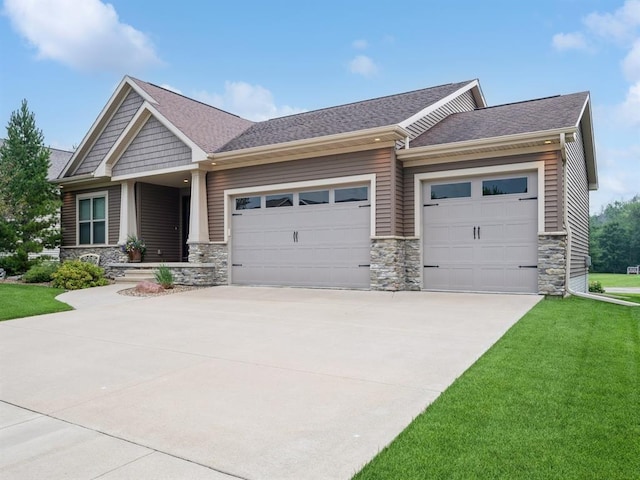 craftsman-style home with a garage and a front yard