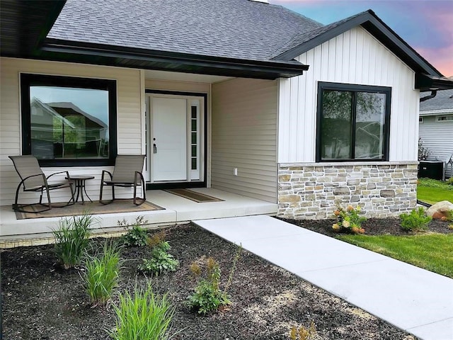 exterior entry at dusk with a porch