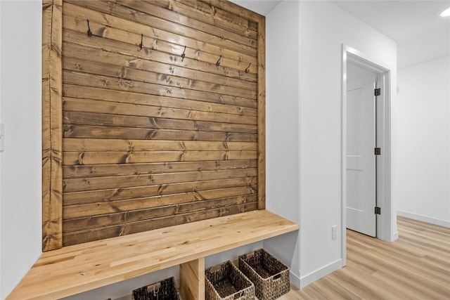 mudroom with light hardwood / wood-style floors